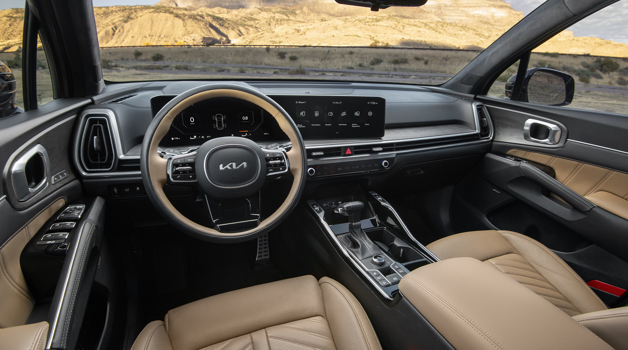 2025 Kia Sorento X-Pro SX Prestige AWD interior, full view of the driver cockpit, featuring a two-tone wheel and Dual Panoramic Display