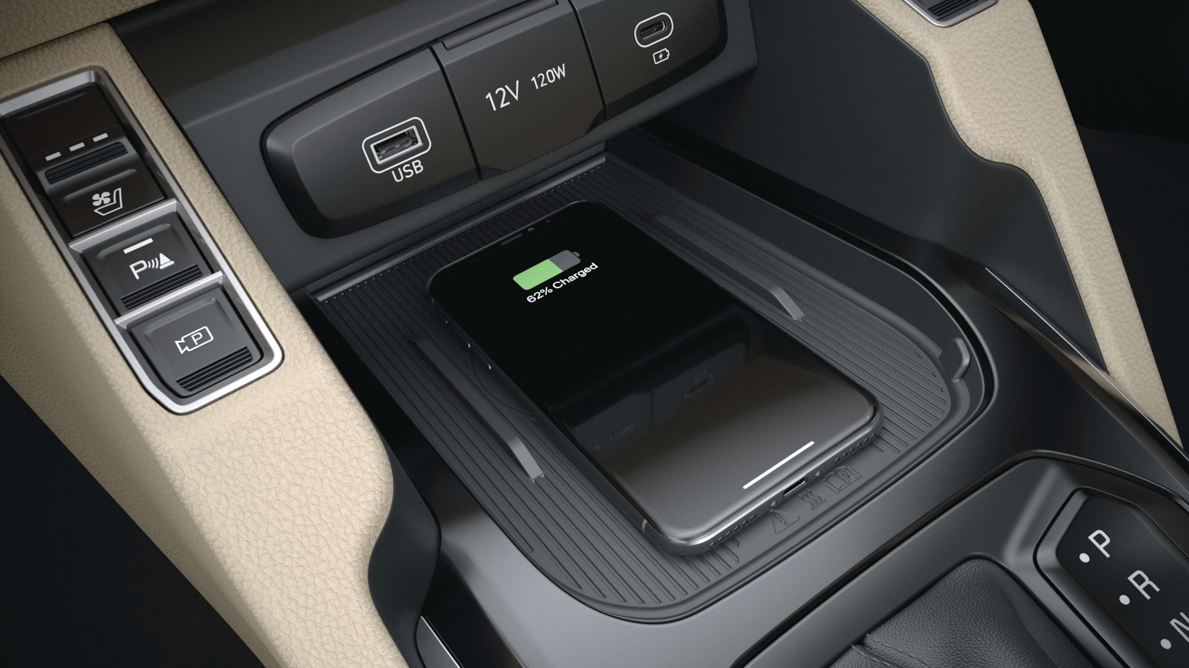 Kia Carens Interior image of mobile phone charging via car USB