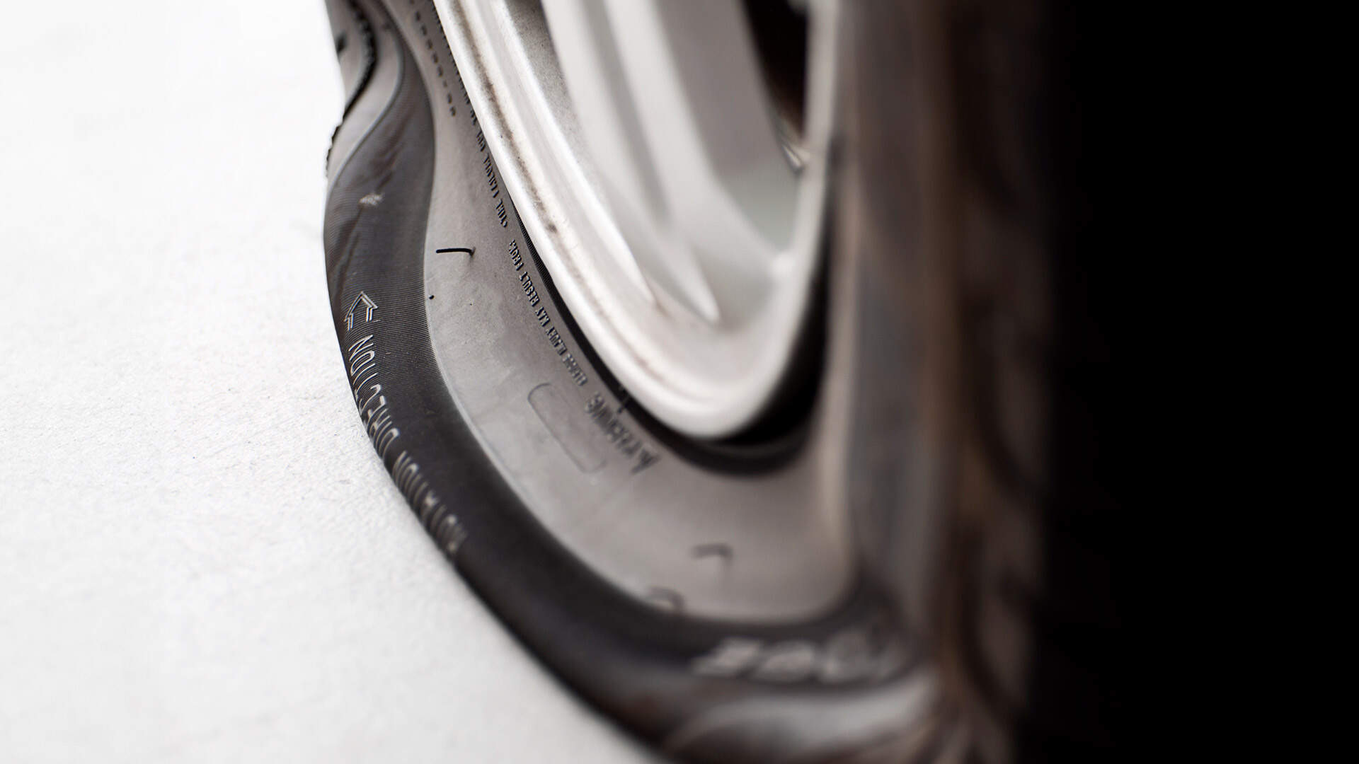 Close-up of a flat tyre