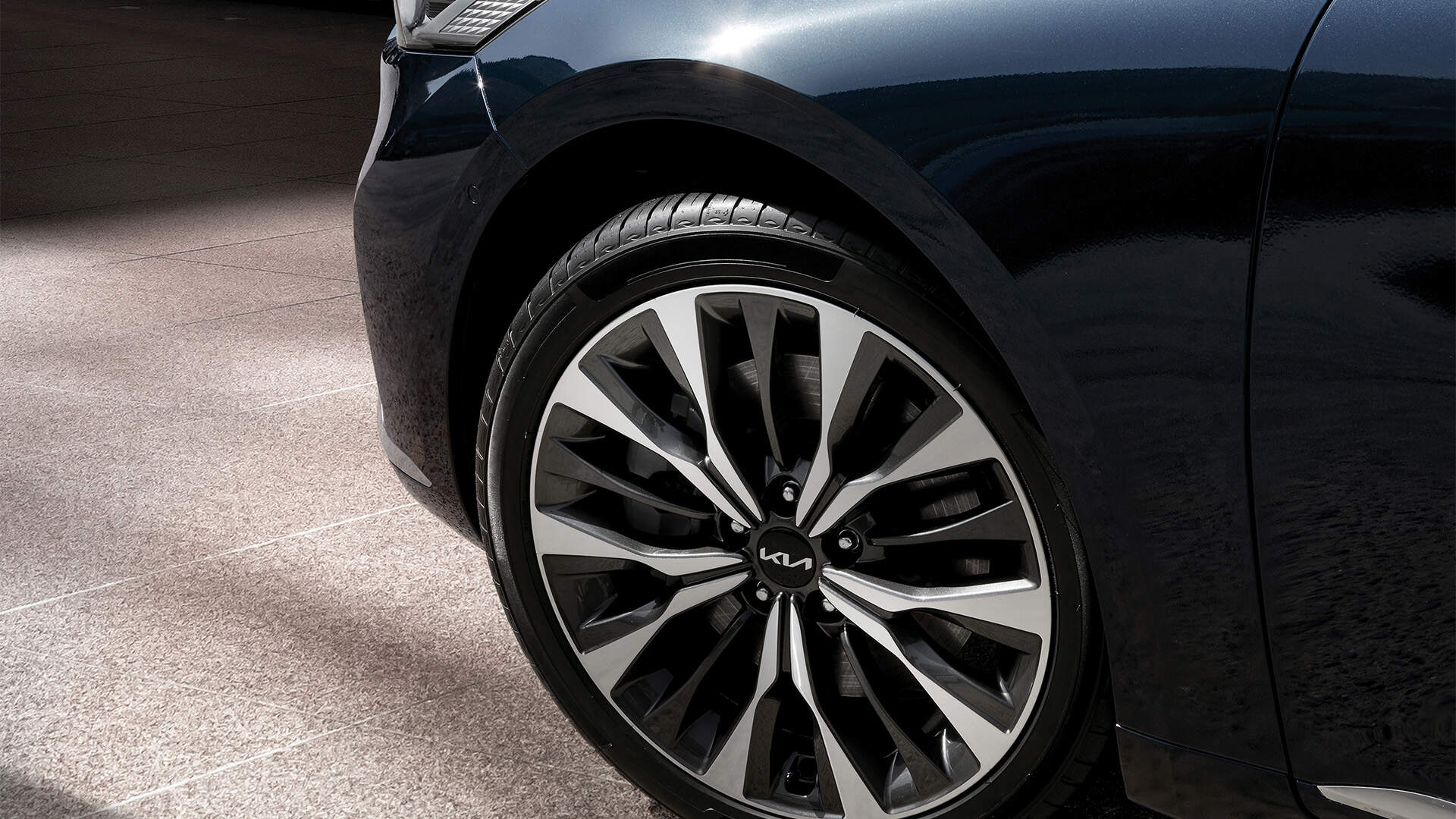 Close-up of a front left tyre of the Kia vehicle