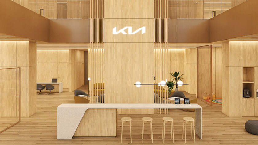 Front view of Kia dealership's warm wooden interior