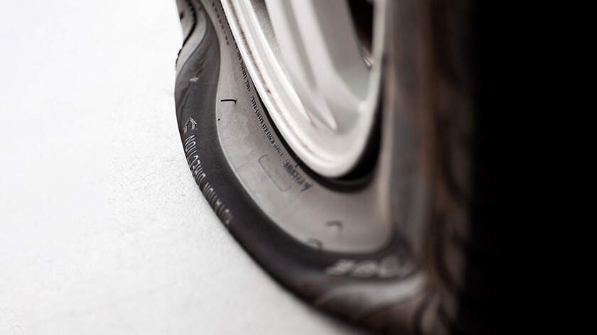 Close-up of a flat tire