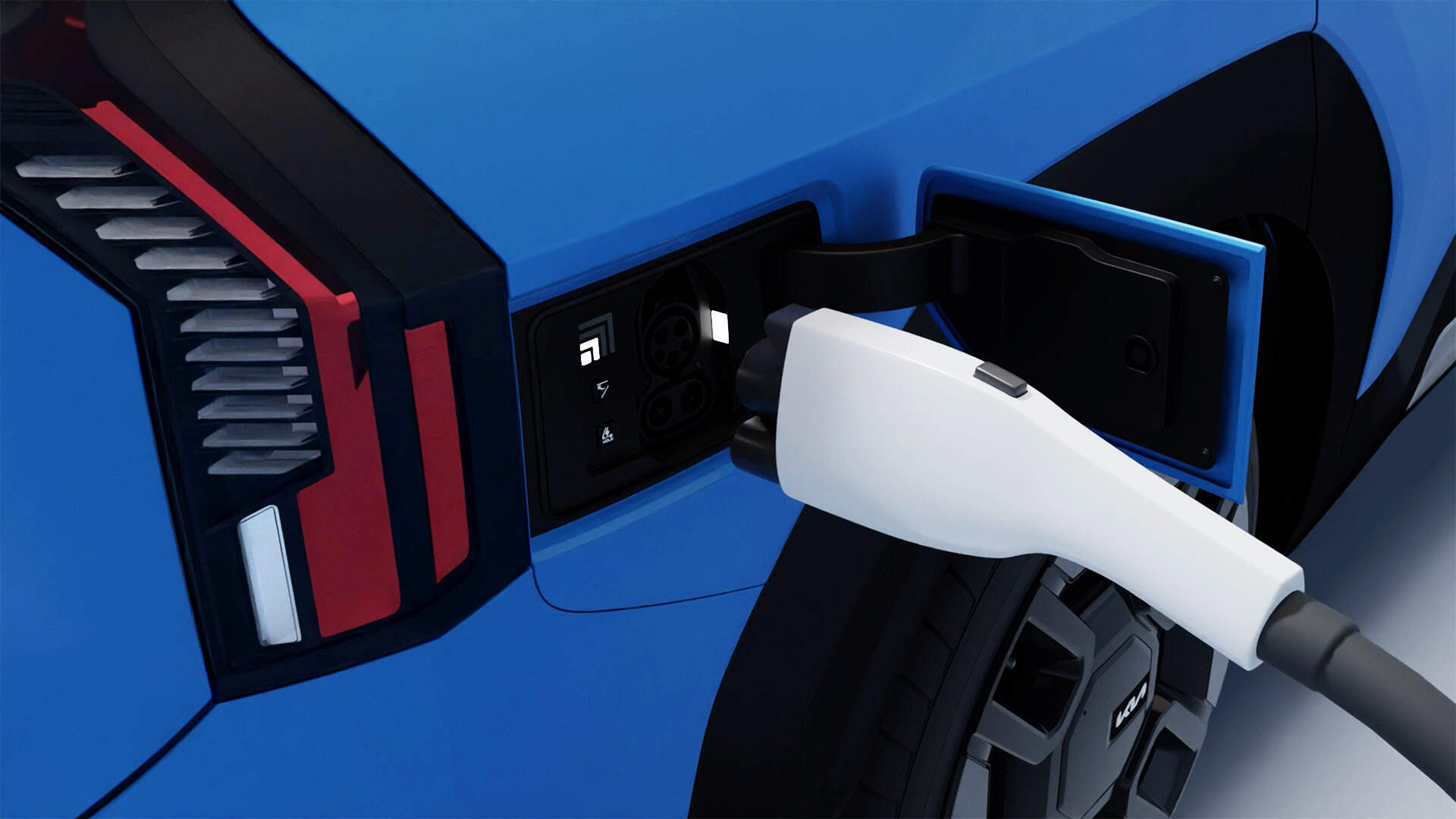 A close-up of a blue Kia EV9 being charged at a charging station