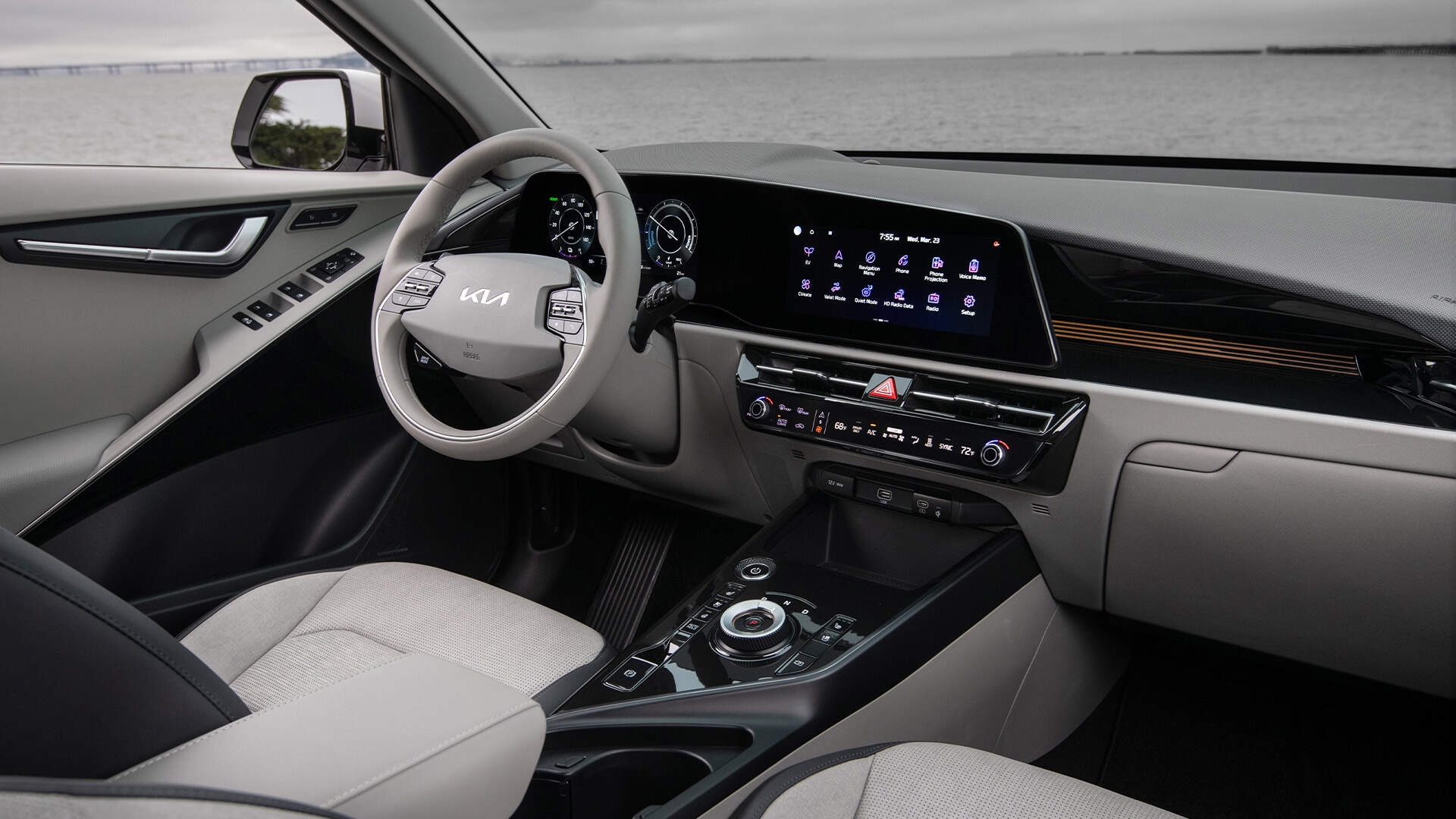 Interior of a Kia vehicle, showing the dashboard with a large display